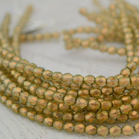 Halo Linen 4mm Faceted Round Beads - Qty 50 Fire Polished Czech Glass Beads - Transparent Beige Khaki with Gold Halo Finish - Spacer Bead