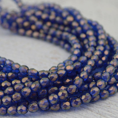 HALO ULTRAMARINE 4mm Faceted Round Czech Glass Beads / Fire Polished Qty 50 Transparent Dark Sapphire Blue Gold Halo Firepolished