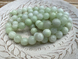 MELON 1Omm Faceted Round Jade Beads /Full Strand Dyed Mountain Jade beads in a light pastel green /Great Earring Necklace Size