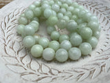 MELON 1Omm Faceted Round Jade Beads /Full Strand Dyed Mountain Jade beads in a light pastel green /Great Earring Necklace Size