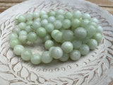 MELON 1Omm Faceted Round Jade Beads /Full Strand Dyed Mountain Jade beads in a light pastel green /Great Earring Necklace Size