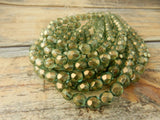 HALO HEAVENS 6mm Faceted Round Czech Glass Beads Qty 25 Fire Polished, Gorgeous Light Green with Metallic Gold Finish