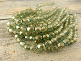 HALO HEAVENS 6mm Faceted Round Czech Glass Beads Qty 25 Fire Polished, Gorgeous Light Green with Metallic Gold Finish